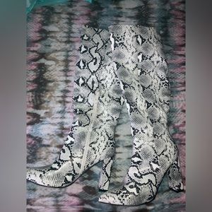 Snake print boots calf length right below the knee